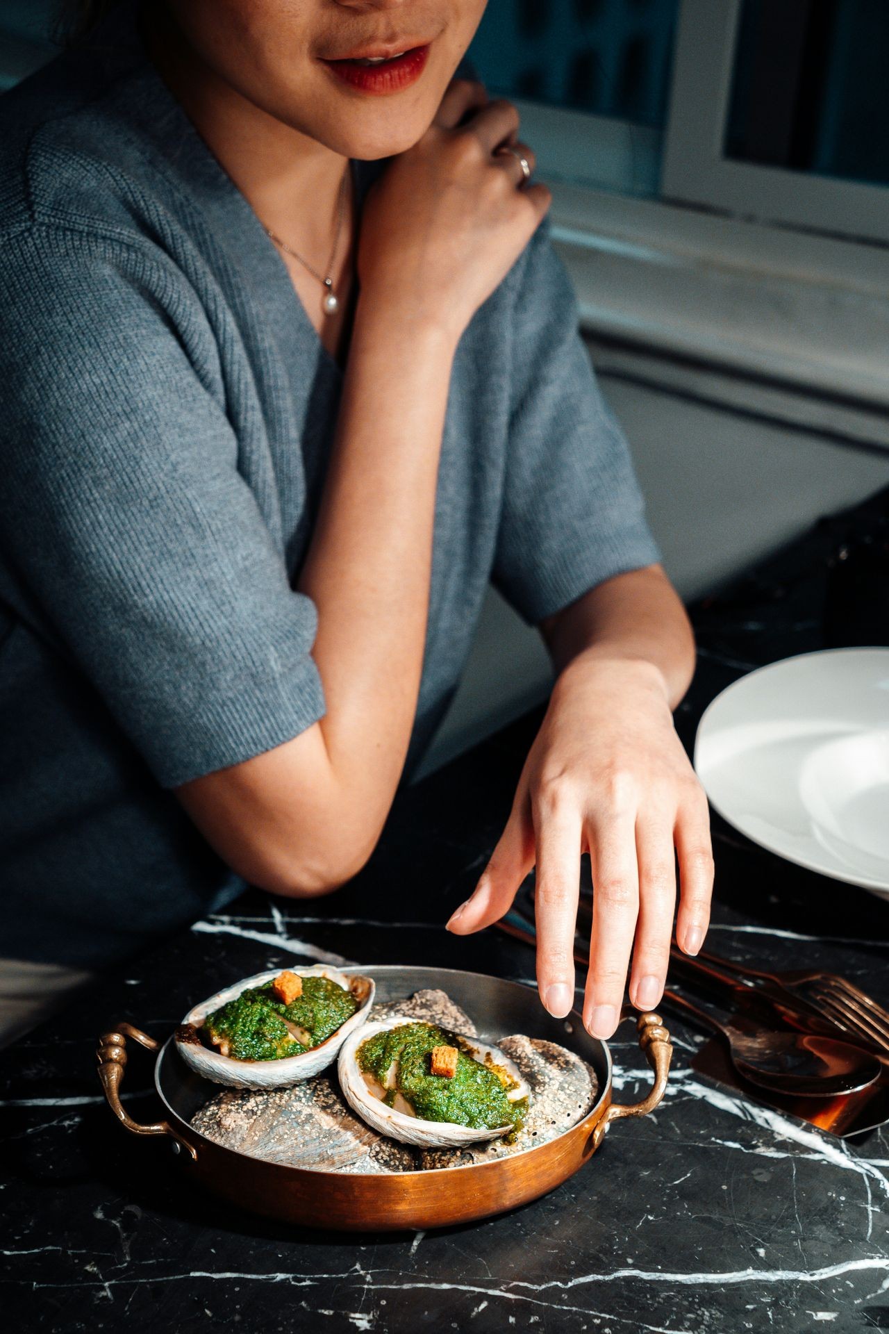Couple enjoying a private chef experience on their patio with wine pairing